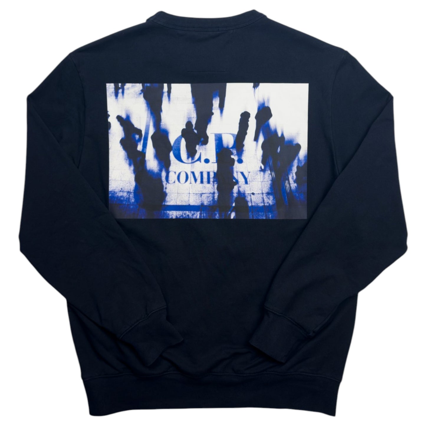 A navy blue crewneck sweatshirt with a large rectangular graphic print on the back. The graphic features a white background with blue paint splatters and black silhouettes of figures, with the text 'C.