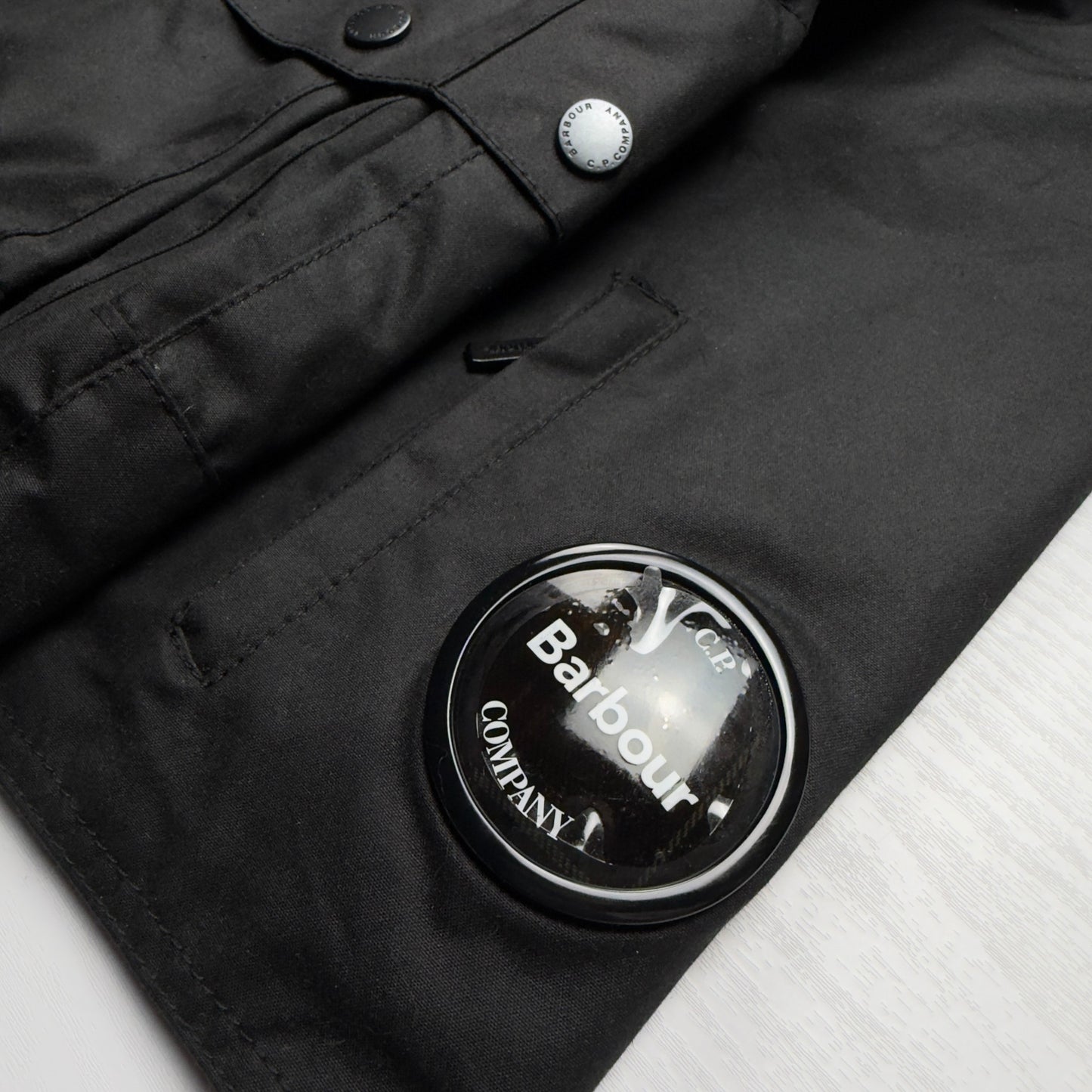 A/W 23 C.P. Company x Barbour Wax Cotton Creel 500 Mille Goggle Jacket - Black